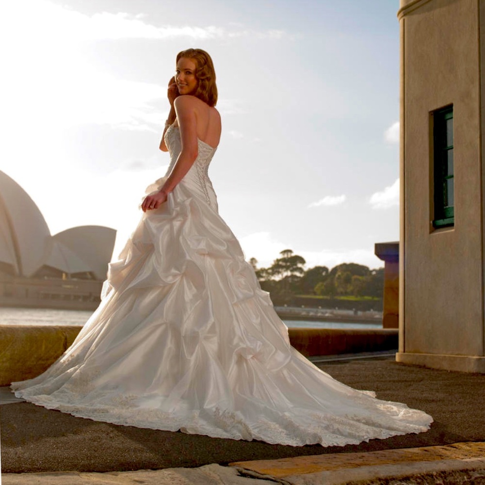 Worn for two hours only. Dress is in pristine & professionally cleaned.
